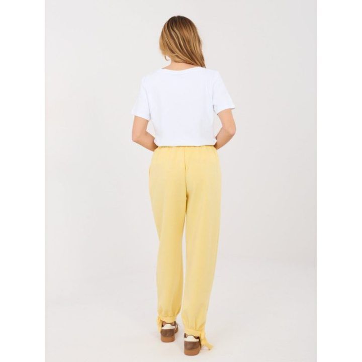 Moteriškos treninginės kelnės šviesiai geltonos spalvos