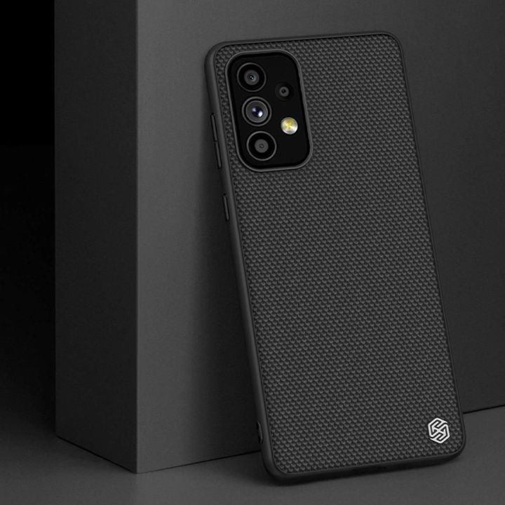 Nillkin Textured Case patvarus sustiprintas dėklas su gelio rėmeliu ir nailonine nugarėle Samsung Galaxy A73 , juodas