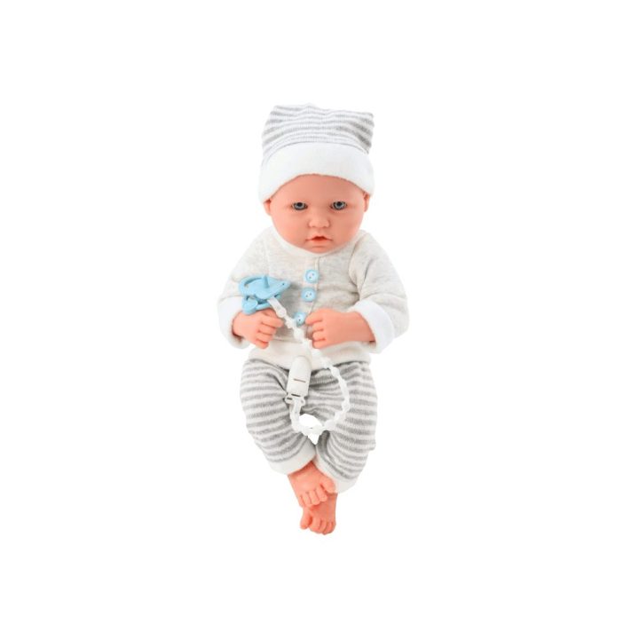 Baby doll in white and gray striped clothes, hat, pacifier, quilt