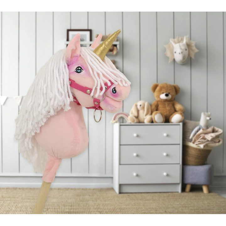 Hobby Horse vienaragis ant lazdos rožinis su balta karčiene ir auksiniu ragu