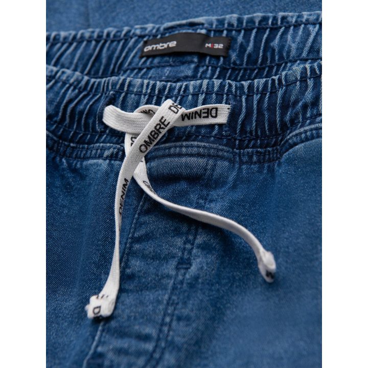 Vyriškos mėlynos jogger tipo kelnės su washed efektu